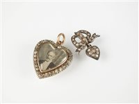 Lot 155 - A heart shaped diamond set pendant