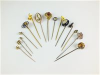 Lot 53 - A collection of fifteen stick pins