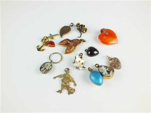 Lot 108 - A collection of twelve charms