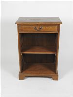 Lot 420 - A modern oak low wall unit with rectangular top above a frieze drawer and adjustable shelf