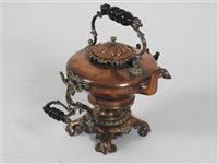 Lot 427 - A Victorian copper spirit kettle on elaborate two-handled stand