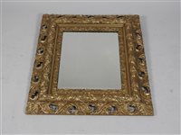 Lot 435 - A rectangular wall mirror, the bevelled glass within a gilded picture frame style