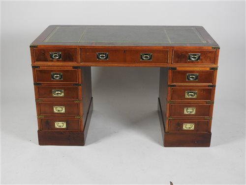 Lot 428 - A House of Fraser supplied yew wood veneered and brass mounted campaign style pedestal desk