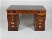 Lot 428 - A House of Fraser supplied yew wood veneered and brass mounted campaign style pedestal desk