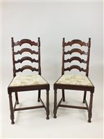 Lot 470 - A set of six French cherrywood ladder back dining chairs