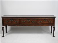 Lot 569 - George III oak and walnut cross banded dresser base