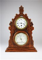 Lot 454 - A Victorian gothic oak cased combined mantel timepiece and barometer