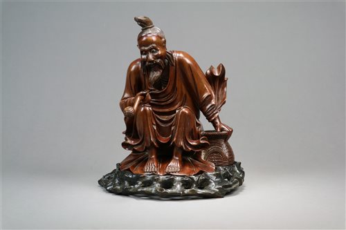 Lot 128 - A Chinese Carved Root Wood Figure of a Sage