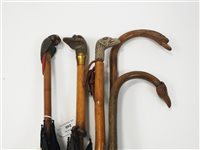 Lot 248 - A collection of six various walking sticks and umbrellas