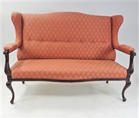 Lot 287 - An Edwardian mahogany wing back settee