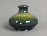 Lot 306 - A Moorcroft green colour trial vase