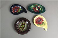 Lot 108 - Three Moorcroft ash trays and a Moorcroft trial coaster