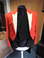 Lot 423 - Two gentlemen's hunting tailcoats, red and black, with monogrammed buttons