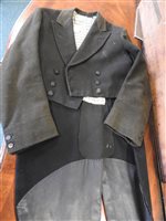 Lot 423 - Two gentlemen's hunting tailcoats, red and black, with monogrammed buttons