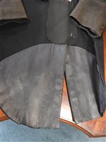 Lot 423 - Two gentlemen's hunting tailcoats, red and black, with monogrammed buttons