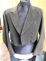 Lot 423 - Two gentlemen's hunting tailcoats, red and black, with monogrammed buttons