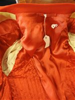 Lot 423 - Two gentlemen's hunting tailcoats, red and black, with monogrammed buttons