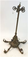 Lot 279 - A brass electrified five-branch gasolier with amber glass lampshades