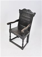 Lot 605 - A joined oak open carved chair, part 17th century