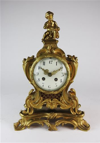 Lot 100 - A Louis XV style gilt metal mantel clock