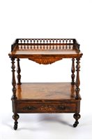 Lot 398 - A Victorian walnut veneered two tier whatnot