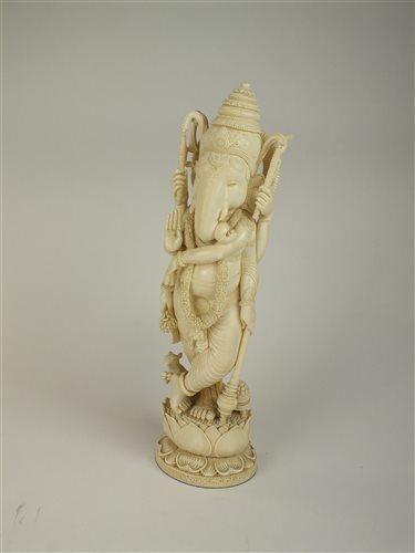 Lot 151 - A large Indian carved ivory figure of Ganesh