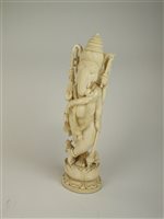 Lot 151 - A large Indian carved ivory figure of Ganesh