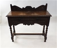 Lot 525 - A Victorian carved oak side table