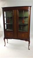 Lot 451 - An Edwardian mahogany and in laid bow front display cabinet