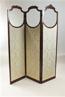 Lot 516 - An Edwardian mahogany two-fold three panel partly glazed screen