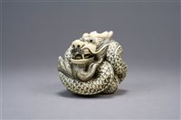 Lot 204 - A Japanese Ivory Okimono  of a Dragon