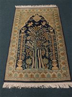 Lot 543 - A Persian cobalt grand Tree of Life rug