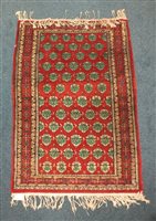 Lot 536 - A Tekke red ground rug