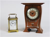 Lot 207 - An inlaid oak cased Art Nouveau mantel timepiece circa 1900