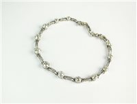 Lot 100 - A diamond set bracelet