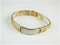 Lot 123 - A 9ct gold jade panel bracelet