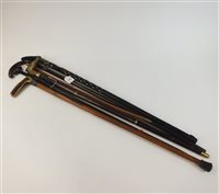 Lot 135 - A collection of six walking sticks