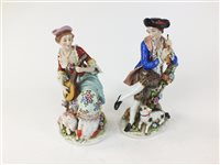 Lot 93 - A pair of Continental porcelain figures of male and female musicians