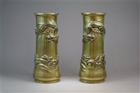 Lot 120 - A Pair of Chinese Brass Dragon Sleeve Vases