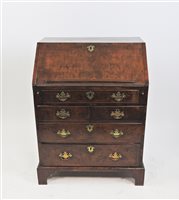 Lot 572 - A Walnut cross-banded bureau
