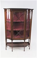 Lot 597 - An Edwardian mahogany and satinwood cross banded break-front display cabinet