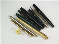 Lot 70 - A regimental pin and a collection of pens
