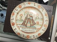 Lot 215 - Four Dutch decorated creamware plates, 18th century
