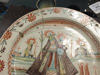 Lot 215 - Four Dutch decorated creamware plates, 18th century