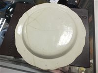 Lot 215 - Four Dutch decorated creamware plates, 18th century