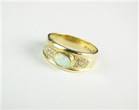 Lot 85 - An opal and diamond dress ring