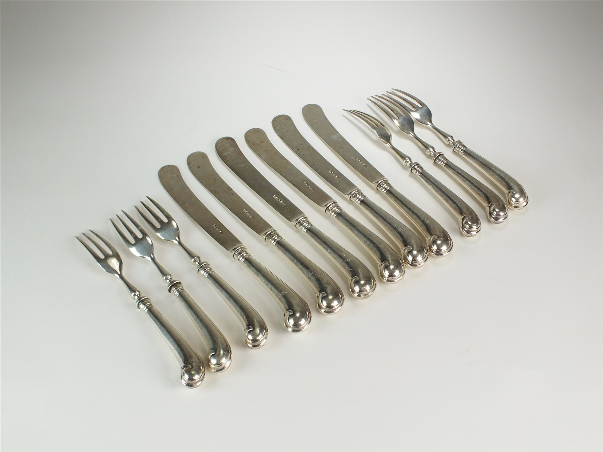 Lot 11 A collection of silver pistol grip cutlery
