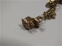 Lot 65 - A 9ct gold charm bracelet
