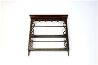 Lot 291 - An early 20th century oak wall hanging plate rack