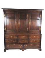 Lot 619 - A George III oak house keepers cupboard